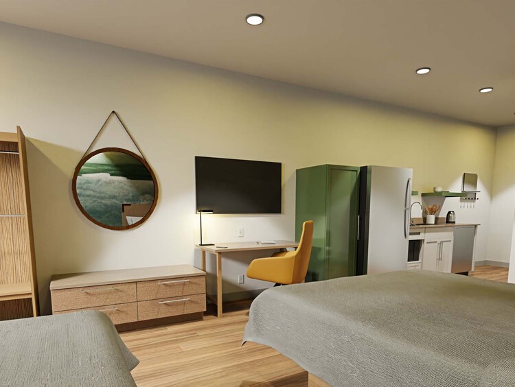 Double Queen room with two queen beds, a work desk, and kitchen