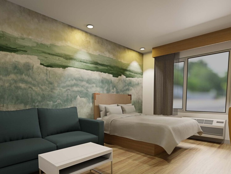 Standard Queen room with one queen bed and a sofa
