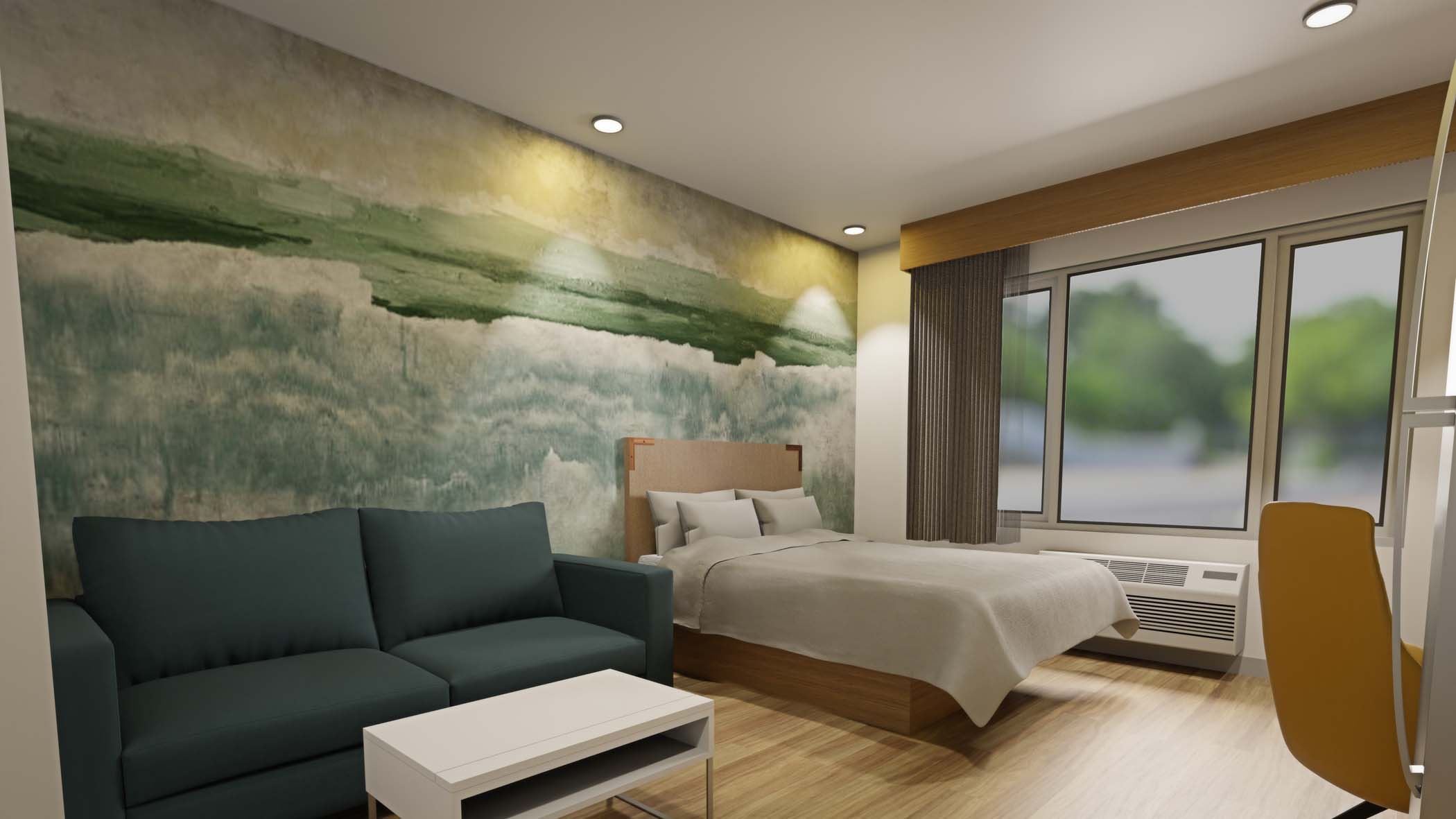 Standard Queen ADA room with a queen bed and sofa