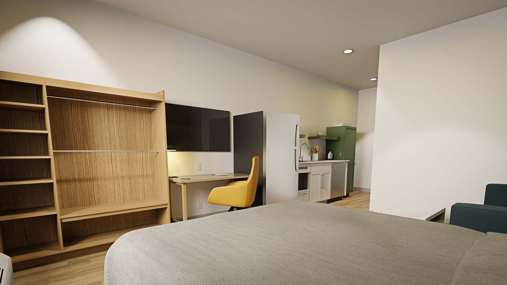 Standard Queen ADA room with one queen bed, a work desk, and kitchen