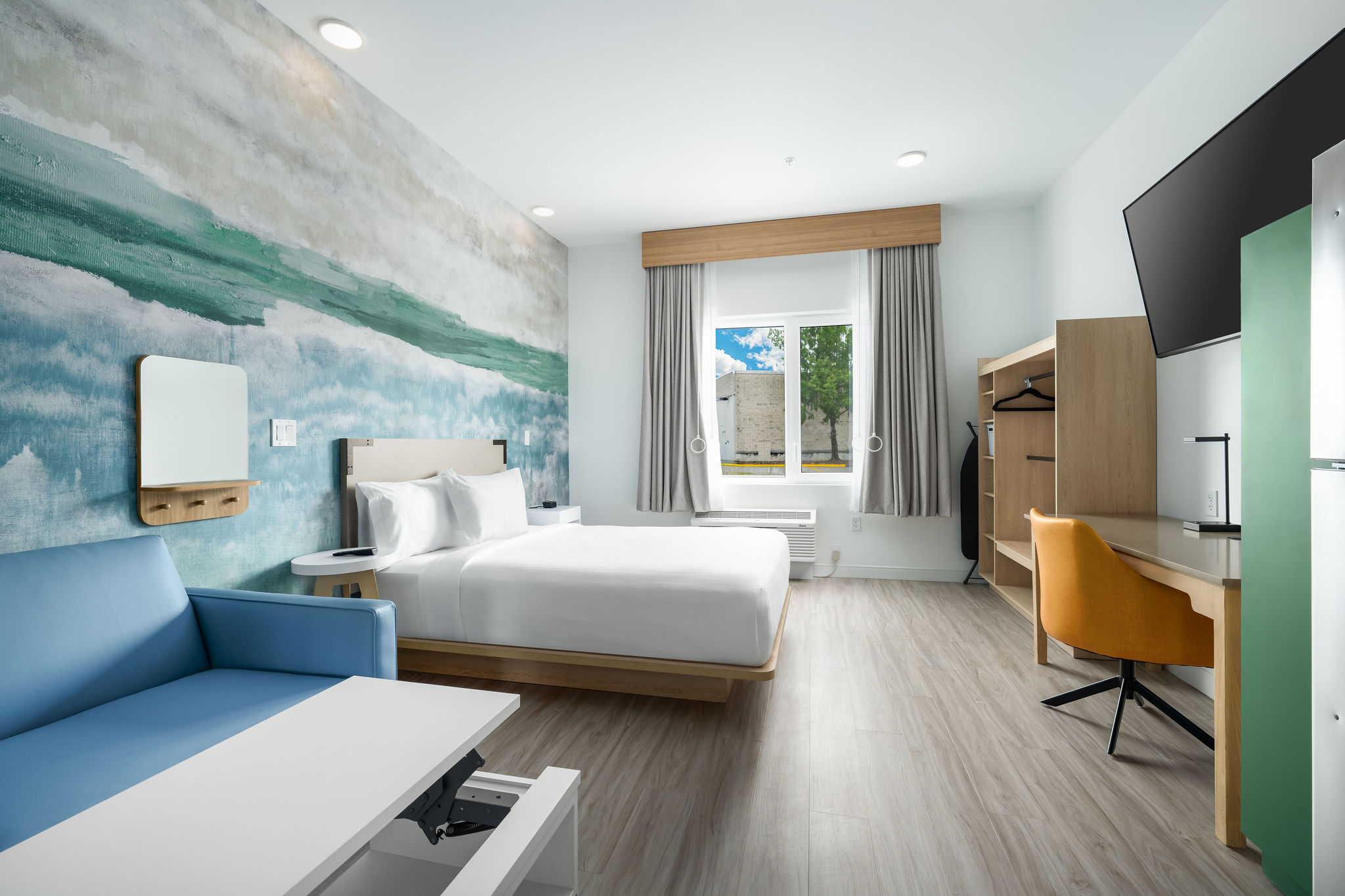 Standard Queen room with in sleeper sofa and a full kitchen